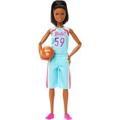 a barbie doll holding a basketball ball and wearing a blue uniform with pink trims