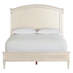 a bed with white linens and pillows on it's headboard, against a white background