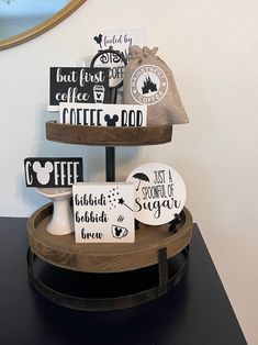 three tiered tray with coffee signs on it