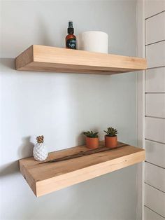 two wooden shelves with pots and plants on them