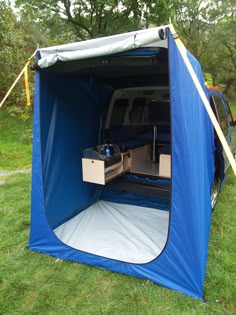 an image of a blue tent with the door open and it's contents inside