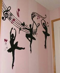 the wall is decorated with black silhouettes of ballet dancers and musical notes on pink stripes