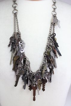 "Vintage Antique Distressed Keys Skeleton Keys Lock Handcrafted Repurposed Statement Charm Necklace OOAK Steampunk Novelty Quirky Jewelry. Love the vintage look in your home??? Incorporate it into your dressing as well This hand crafted double strand statement necklace contains an assortment of 45 vintage, distressed keys of various complimentary sizes that I have collected over the years. Also attached is a little lock and key that you can take off and use if you choose! Measures 16 1/2\" long. Old Keys Crafts Diy, Repurposed Accessories, Junk Necklace, Necklace Keys, Old Key Crafts, Clutter Necklace, Skeleton Key Lock, Goodwill Bins, Key Crafts