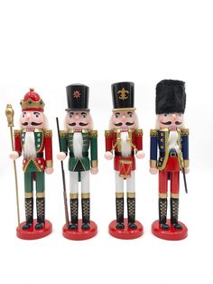 three nutcrackers are standing next to each other