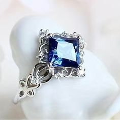 a ring with a blue stone in it