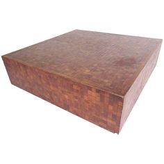 a large wooden box sitting on top of a white surface with no one around it