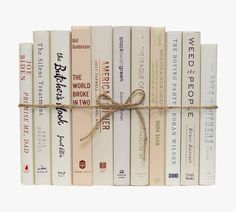 a bunch of books tied up with a rope