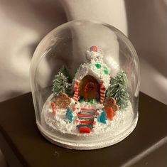 a snow globe with christmas decorations on it