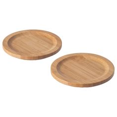 two wooden plates sitting on top of each other