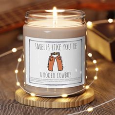 a candle that says smells like you're a rodeo cowboy