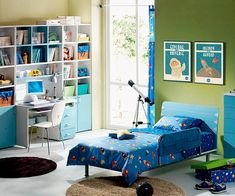 a child's bedroom with green walls and blue furniture