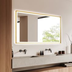 a bathroom with two sinks and a large mirror over it's counter top,