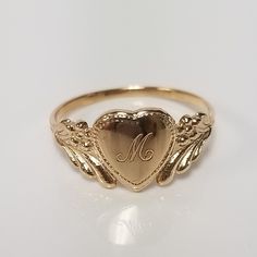 "Thanks for shopping our vintage estate store. We tend to sell well below wholesale and truly hope you enjoy all of our items. Many of the items are one of a kind, so please enjoy scrolling through the pictures and hopefully something will catch your eye. Brown spots are from camera or reflections. Estate 14k yellow gold monogram cursive capital M heart ring. Custom made ring for our shop. Ring size: 3 Setting: 7.5mm 1/4\" to 3/8\" Band width: 1.4mm Weight: 1.09 grams Marked 14k and it's sweet. Mariah Core, Cursive M, Antique Style Rings, Lifestyle Women, Dope Jewelry, Gold Monogram, Gold Link, Funky Jewelry, Jewelry Lookbook