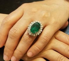 Gorgeous 14k white gold natural green emerald ringcenter natural emeraldOval  cut weight 10.25ct. Size 17x11.5gorgeous color nice luster ,nice cut,medium dark green colorside diamonds total weight 2.50ct. H-SI1ring size 6.5Retail value $19,500 net .Appraisal availablehttps://www.instagram.com/p/CAqlczTFXV0/?igshid=zhl7j3sdfhlt Emerald Watch, Green Diamond Rings, Pop Jewelry, Indian Wedding Jewelry Sets, Gemstone Diamond Ring, Green Emerald Ring, Celebrity Engagement Rings, Antique Diamond Rings, Gold Rings Fashion