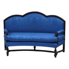 a blue couch sitting on top of a wooden frame