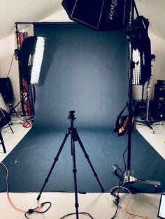 a photo studio with several lighting equipment