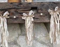 a wooden bench decorated with twine bows and stars