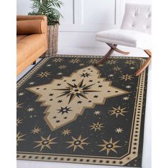 a black and gold rug with stars on the floor in front of a white chair