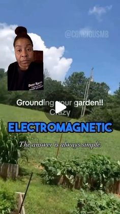 a woman standing in front of a garden with an electronic sign above her head that reads, grounding your garden