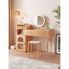 a wooden desk with a mirror and stool next to it on a rug in front of a window