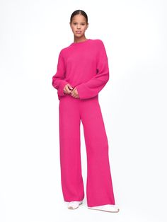 Supersoft cotton-blend, shaker-stitch sweater pants.  Elasticized waist.  Fit: Slim.  A semi-fitted silhouette that fits close to the body at the waist and hip, with a slight ease through the thigh.  Wide leg.  Models wearing Gap Plush Yarn, Stitch Sweater, Sweat Suit, Brand Collaboration, Everyday Luxury, Cozy Outfit, Sweater Pants, Fitted Silhouette, Neon Pink