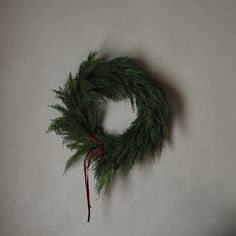 a green wreath hanging on the wall