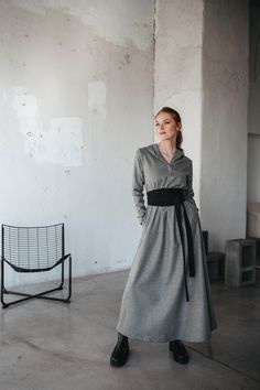 Wrap yourself in warmth and elegance with our wool maxi dress, designed to combine comfort and style. This dress features a flattering V-neckline and a cozy hood, making it perfect for cooler weather. The flowing maxi-length silhouette offers a relaxed yet refined look, while the side pockets add a practical touch.  Crafted from high-quality wool, this dress provides warmth and style. Whether you're dressing it up for a special occasion or keeping it casual, this versatile piece is perfect for any wardrobe. You can order the dress with an obi belt in a matching color, or without it, depending on your preference. ♠ Sizes My body Size Chart is available below. ** Custom Orders For any changes or adjustments you may need, please contact us before making a purchase. The amount of the additiona Winter Dress For Women, Wool Maxi Dress, Dress With Hood, Wool Clothing, Dress Handmade, Fall Dress, Winter Dress, Cooler Weather, Wool Dress