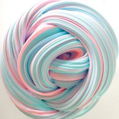 there is a ball of colored paper in the air with it's end curled up