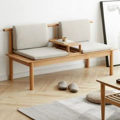 two wooden benches sitting on top of a hard wood floor