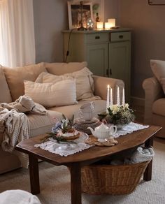 a living room with two couches and a coffee table in the middle of it