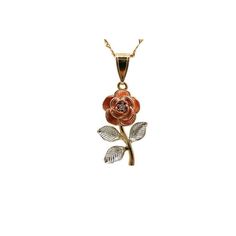 a gold necklace with a rose and leaves hanging from it's center, on a white background