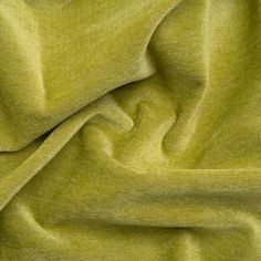 a close up view of a green fabric