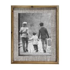 an old photo frame with the number four on it and two children holding hands in front of