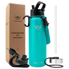 a blue water bottle with a black lid next to a cardboard box and thermos