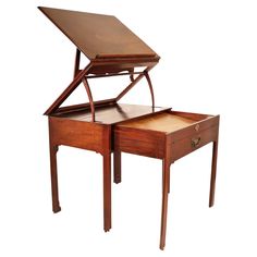 a wooden desk with two drawers and a tray on it's top that is open