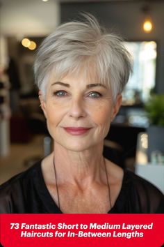 Older woman with a grey pixie haircut featuring layered texture for added volume. Pixie With Layers