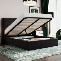 a bed that is sitting in the middle of a room with a mattress on top of it