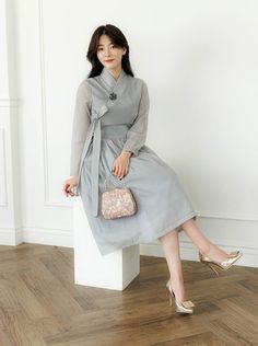 This is a Korean Modern Hanbok Wrap Style Dress for Women. This hanbok is modernly designed so you can wear it comfortably and beautifully. This modern hanbok is perfect dress for daily and special celebrations such as parties or various events. 📐Model size Height 5.57ft(170cm) Waist circumference 26in(66cm) Wearing a size F ⭐Please check out the link below for the see through cover skirt the model in the photo is wearing. https://www.etsy.com/listing/1311197605/ ⭐Decorate more stylishly with accessories that go well with Hanbok. 🟠 Go look hanbok accessories: https://www.etsy.com/shop/LunarJogak?ref=seller-platform-mcnav&section_id=33148097 🟠 Go look hanbok hair accessories: https://www.etsy.com/shop/LunarJogak?ref=seller-platform-mcnav&section_id=33326881 The color of the clothes may l Hanbok Dress Modern, Style Dress Korea, Hanbok Women, Hanbok Accessories, Hanbok Hair, Modern Hanbok Dress, Modest Classy, Hanbok Dress, Dress Korea