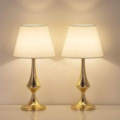 two lamps are sitting next to each other