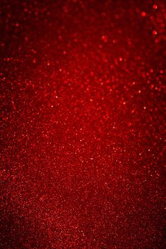 red glitter textured background with space for your text or image, can be used as a wallpaper