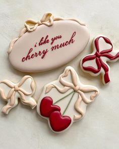 three decorated cookies that say i like you cherry much