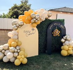 an outdoor event with balloons and decorations