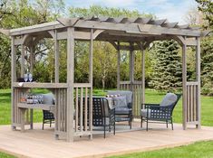 a wooden gazebo sitting on top of a lush green field