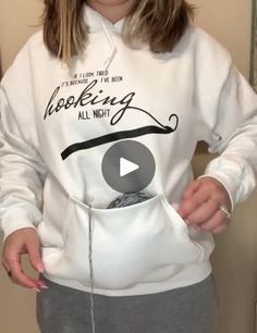 a woman wearing a white hoodie with the words hooking all night on it