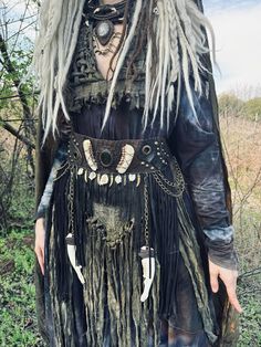 a woman with long white hair wearing a costume