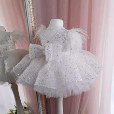 Elevate any special occasion with our Glitter Short Ball Gown Sequins Feather Flower Girl Dress with Bow. The sparkly glitter and delicate sequins will make your little one shine, while the voluminous short ball gown style adds a touch of elegance. Complete the look with the charming bow for a truly enchanting and beautiful ensemble. Tutu Birthday Party, Sequin Flower Girl Dress, Christening Dress, Girl Princess Dress, Birthday Tutu, Birthday Party Dress, Bridal Robes, Gowns With Sleeves, Line Dress