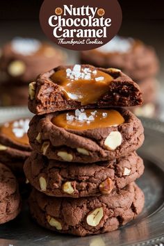 nutty chocolate caramel cookies are stacked on top of each other with sea salt