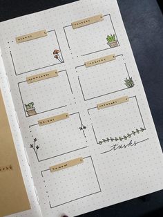 an open planner with plants on it