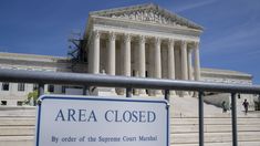 there is a sign that says area closed in front of the supreme court