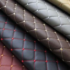 several different colored ties are lined up in the same color and pattern as they appear to be made from real leather